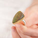 Close up of Rainbow Pyrite Druzy ring with gold bezel and silver band