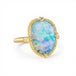 Ring with a boulder opal stone and gold band on a white background