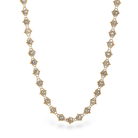 Gold necklace with silver diamonds on a white background