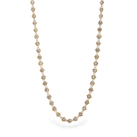 Gold necklace with silver diamonds on a white background