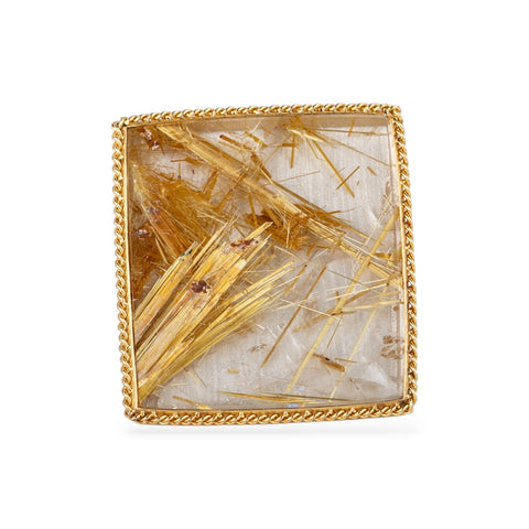 Front surgace of a ring made with a rutilated quartz, 18k gold bezel and sterling silver band