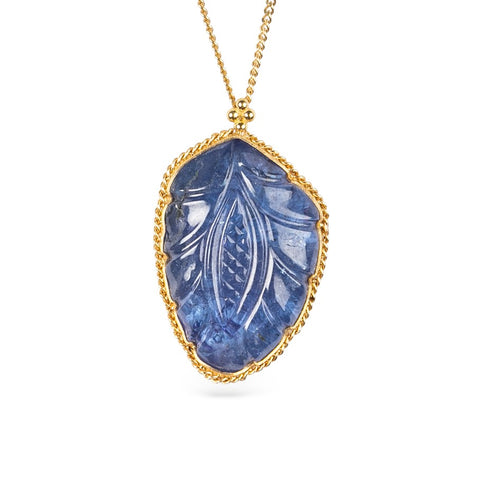 Handcrafted gold necklace featuring a leaf-shaped tanzanite on a white background