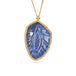 Handcrafted gold necklace featuring a leaf-shaped tanzanite on a white background