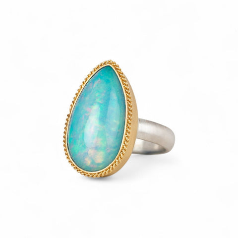 Ethiopian opal ring with 18k gold bezel and sterling silver band