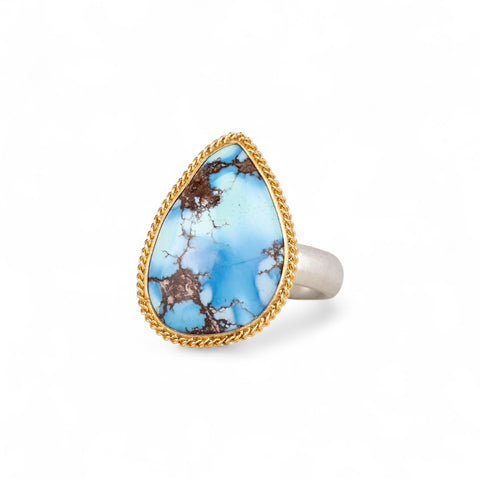 Turquoise teardrop ring with gold bezel and sterling silver band
