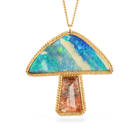 Gold necklace with a mushroom pendant featuring opal and spessartite stones.