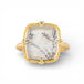 Ring with gold band and dendritic quartz stone stone on a white background