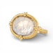 Gold ring with a dendritic quartz stone on a white background