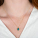 A model wears an australian opal doublet and 18k yellow gold necklace.