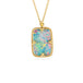 Handmade australian opal doublet and 18k yellow gold necklace on a white background.