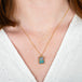 A model wears an australian opal doublet and 18k yellow gold necklace.