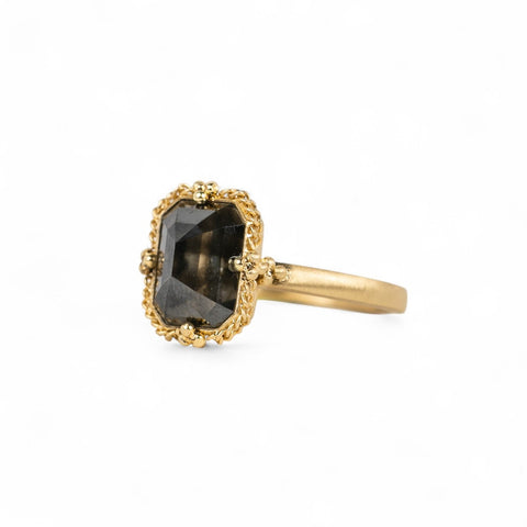 Side view of a handmade 18k yellow gold and rectangular black diamond ring