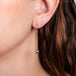 Blue akoya pearl earrings on model