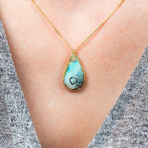 Boulder opal feather necklace on model
