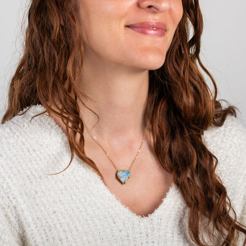 Boulder opal heart necklace on model side view