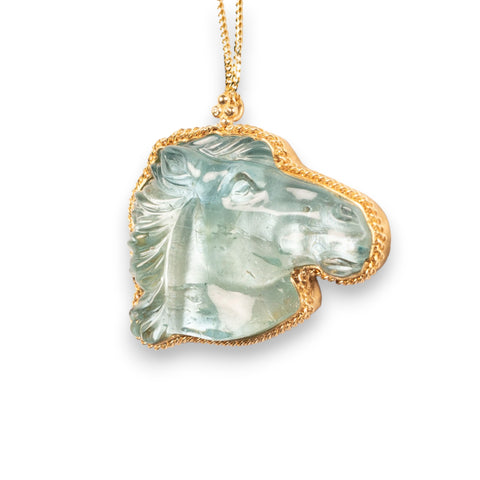Carved aquamarine horse necklace side view