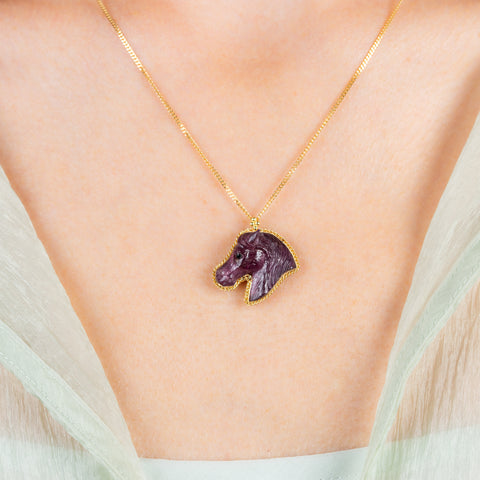 Carved tourmaline horse necklace on model