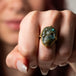 Carved labradorite skull ring on model spooky
