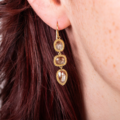 Champagne diamond trio earrings on model
