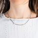Oxidized silver and gold necklace with pearls on a model