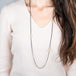 Oxidized silver and gold hoop necklace on a model