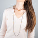 Contrast gold hoop necklace paired with interlocking circles necklace on a model
