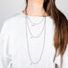 Oxidized silver and 18k yellow gold chain necklace size reference on a model.