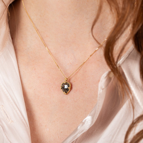 Dark chestnut diamond necklace on model side view