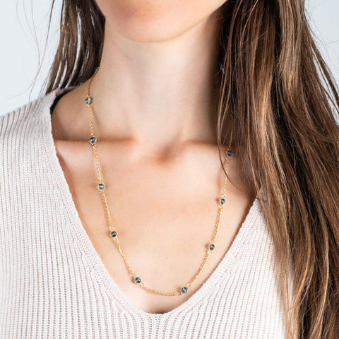 18k gold and london blue topaz on a model