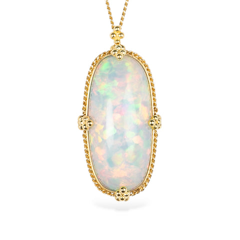 Ethiopian opal gemstone and 18k yellow gold necklace on a white background.