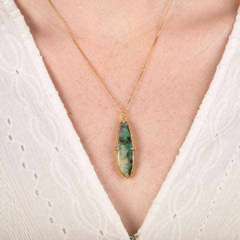 Boulder opal necklace on model