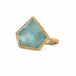 18k yellow gold ring featuring an aquamarine carved into a pentagon shape with protruding facets giving it a three-dimensional quality.