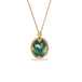Green tourmaline and gold necklace on white background