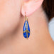 Draped Lapis earring on a model