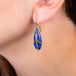 Draped Lapis earring on a model side view