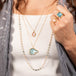 Carved aquamarine necklace styled with morganite on model