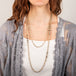 Labradorite necklaces in various sizes on a model