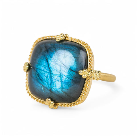 A square-shaped Labradorite gemstone ring set in a handcrafted 18k yellow gold bezel.