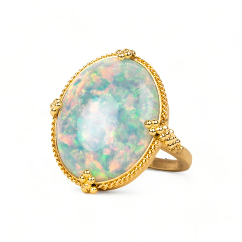 Large oval ethiopian opal ring on white background