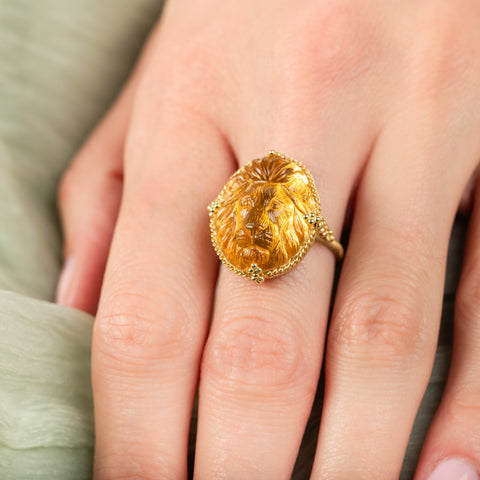 Carved citrine lion ring on model