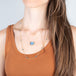 london blue topaz whisper chain necklace and blue elephant on model