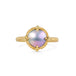 A mabe pearl ring with an 18k gold setting and band, shown against a white background.