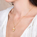 Mexican opal necklace on a model side view