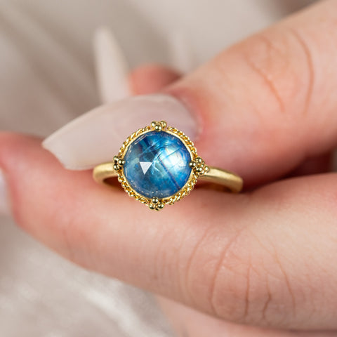 Moonstone ring held in hand