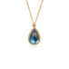 A teardrop-shaped moonstone pendant set in an 18k yellow gold bezel, suspended from a matching gold chain.