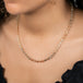 A model wears a chain necklace made of moonstone beads and 18k yellow gold chain.