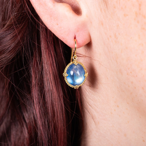 Oval moonstone earrings on model