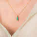Boudler opal necklace on model side view