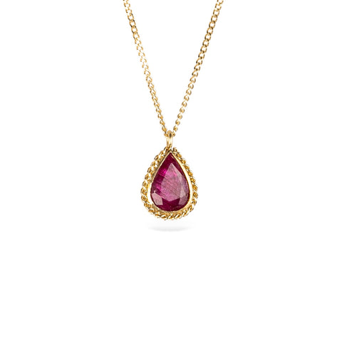 18k yellow gold and ruby gemstone necklace on a white background.