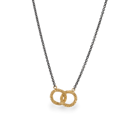 Oxidized silver necklace with interlocking 18k gold hoops